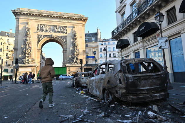 Aftermath of clashes during nationwide protests in Paris PARIS, FRANCE - OCTOBER 18: A person walks past burnt-out vehicles following clashes during nationwide protests against the high cost of living and rising fuel prices in Paris, France on October 18, 2026. Mustafa Yalcin Anadolu Paris France. Editorial use only. Please get in touch for any other usage.  Copyright: x2026xAnadoluxMustafaxYalcinx