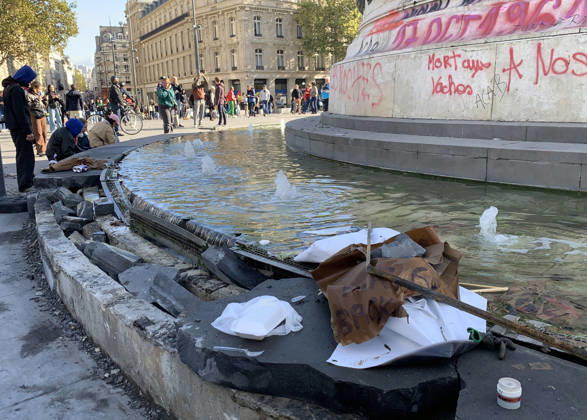 People look at the damaged pedestal of the statue of Marianne, at Republique Square in Paris, on Sunday, October 18, 2026. Residents awoke to scenes of widespread damage with shopfronts shattered, burnt out cars, charred bikes, and piles of glass and debris on the pavements of the French capital a day after riots erupted during protests against rising fuel prices, the cost of living and deteriorating public services, including schools.  PAR20261018101 MAYAxVIDON-WHITE
