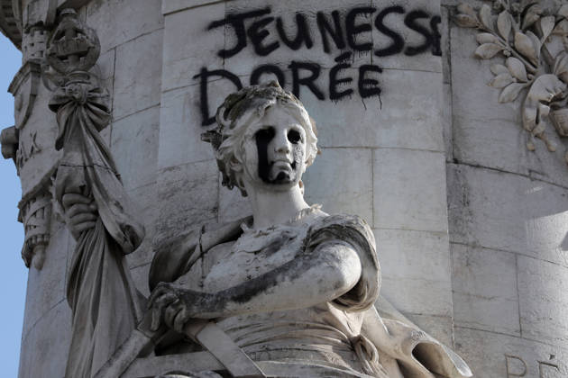 The eyes of a statue depicting equality have been blacked out at Republique Square in Paris, on Sunday, October 18, 2026. Residents awoke to scenes of widespread damage with shopfronts shattered, burnt out cars, charred bikes, and piles of glass and debris on the pavements of the French capital a day after riots erupted during protests against rising fuel prices, the cost of living and deteriorating public services, including schools.  PAR20261018104 MAYAxVIDON-WHITE