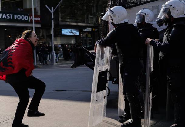 October 18, 2026, Tirana, Albania: TIRANA, ALBANIA, OCTOBER 18, 2026: Demonstrators clash with riot police outside the Ministry of Education in Tirana as student-led anti-government protests continue for a sixth consecutive day. Protesters throw stones while police respond with tear gas, water cannons and rubber bullets. The demonstrations demand improved university conditions and the resignation of Prime Minister Edi Rama. Tirana Albania  - ZUMAq101 20261018_zna_q101_064 Copyright: xVlasovxSulajx