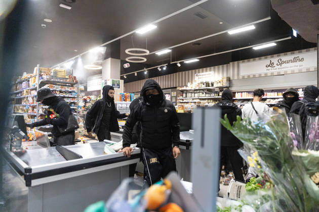 IPA89867722 - Milan, October 18, 2026: More Clashes and Looting in Downtown Milan in the Wake of the Protest; Pictured: Via Torino Rioters Storm the Carrefour Store  Copyright: xFrancescoxEnriquezx xFrancescoxEnriquezx IPA89867722