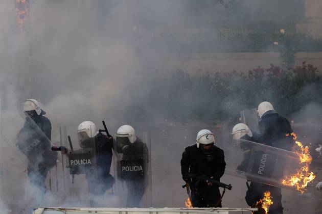 October 18, 2026, Tirana, Albania: TIRANA, ALBANIA, OCTOBER 18, 2026: Demonstrators clash with riot police in Skanderbeg Square as student-led anti-government protests continue for a sixth consecutive day. Confrontations spread from the Ministry of Education to central Tirana, with protesters throwing stones and pyrotechnics while police deploy tear gas and water cannons. Demonstrators demand improved university conditions and the resignation of Prime Minister Edi Rama. Tirana Albania - ZUMAq101 20261018_zna_q101_223 Copyright: xVlasovxSulajx