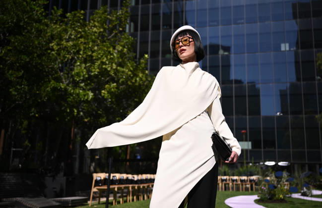 MELBOURNE FASHION WEEK PREVIEW, A guest poses for a photo ahead of a 2026 Melbourne Fashion Week Runway Preview, at Sky Park, Melbourne, Monday, October 19, 2026. The preview features a selection of the upcoming collections that will appear on M FW runways including designers OUT OF HAND x Lisa Waup, Ebony Noire, Van Ermel Scherer, Perple, Gotham, Wilson Jedd Adams, Asiyam, Atoir, NGALI, Kuwaii, HoMie, Collective Closets x Mariam Farah, TOJHÃÄ, Amy Cottrell, BAAQIY and Sean Rentero. ( NO ARCHIVING MELBOURNE VICTORIA Australia  Copyright: xJOELxCARRETTx 20261019180608211848