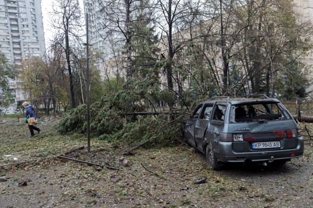 A spruce tree lies on a car in the Solomianskyi district damaged by a Russian attack, Kyiv, Ukraine, October 19, 2026. During the night and morning, Russia launched a massive strike on the capital using ballistic missiles, cruise missiles, and drones. According to Kyiv city head Vitali Klitschko, five people were injured in the Solomianskyi district as a result of the attack. Four residential buildings, a bank office, a private medical clinic, a shopping mall, offices, and vehicles were damaged. (Photo by Kyrylo Chubotin Ukrinform) Russian attack on Kyiv affects shopping mall  Copyright: xKyryloxChubotinx