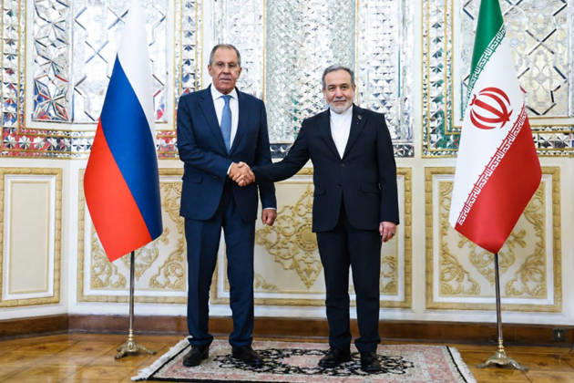 IRAN, TEHRAN - OCTOBER 19, 2026: Sergei Lavrov (L), Russia’s Minister of Foreign Affairs, and his counterpart Abbas Araghchi of Iran shake hands during their meeting. Best quality available. Russian Foreign Ministry TASS  99613919