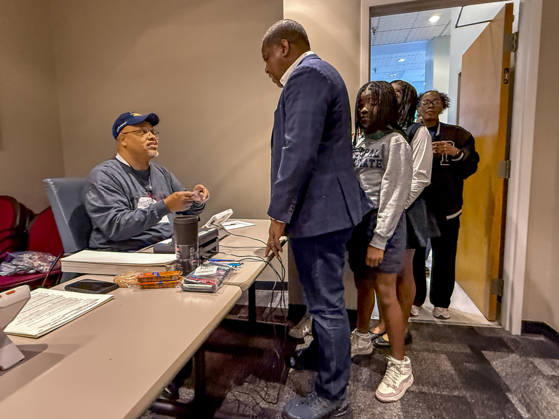 October 19, 2026, Little Rock, Arkansas, USA: Poll worker JERRY SAXTON checks the voter ID of Democratic Congressional candidate CHRIS JONES so he can cast his ballot on the first day of early vote in Arkansas. Jones is running for the seat now held by Rep. French Hill (R-AR). Should Jones win, he will be the first Black person Arkansas sends to Congress. Little Rock USA  - ZUMAd155 20261019_znp_d155_026 Copyright: xSuexDorfmanx