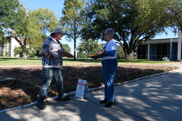 October 19, 2026, Dallas, Texas, USA: Early voting started in Dallas TX on Monday morning...Samuell Grand Recreation Center..Collecting signatures for a local ballot iniative. Dallas USA - ZUMAa183 20261019_znp_a183_009 Copyright: xAvixAdelmanx