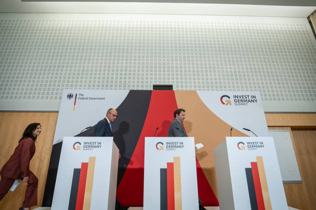 Katherina Reiche, Federal Minister of Economics; Friedrich Merz, Federal Chancellor; and Lars Klingbeil, Federal Minister of Finance (from left) during the closing remarks at the Invest in Germany Summit 2026 at the ESMT European School of Management and Technology in Berlin, Berlin, Germany; ESMT Berlin