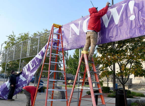 October 20, 2026, Racine, Wisconsin, USA: Workers put up a large banner announcing the start of voting as voters come to Racine City Hall Tuesday morning October 20, 2026 on the first day of early voting in Wisconsin for the midterm elections. There are two closely watched Congressional races, including the First District which includes Racine, and a contentious gubernatorial race on the ballot. Racine USA  - ZUMAh154 20261020_znp_h154_005 Copyright: xMarkxHertzbergx