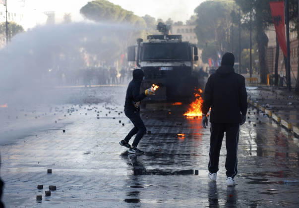 Protesters Clash with Police During a Demonstration in Tirana, Albania. Protesters throw molotov cocktails towards Albanian Police officers during during an anti-government demonstration in central Tirana on October 17, 2026, as protests continued for a fifth consecutive day over university conditions and demands for the resignation of Albanian Prime Minister Edi Rama. The latest rally follows four nights of violence in the capital, during which protesters and riot police clashed, police used water cannons and tear gas, and demonstrators damaged government offices and shops and set fire to several buildings. Light Studio Agency Malton Dibra Tirana Albania Copyright: xLightxStudioxAgencyx xMaltonxDibrax