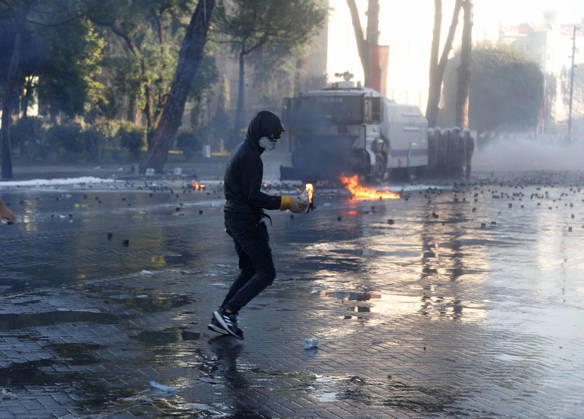 Protesters Clash with Police During a Demonstration in Tirana, Albania. Protesters throw molotov cocktails towards Albanian Police officers during during an anti-government demonstration in central Tirana on October 17, 2026, as protests continued for a fifth consecutive day over university conditions and demands for the resignation of Albanian Prime Minister Edi Rama. The latest rally follows four nights of violence in the capital, during which protesters and riot police clashed, police used water cannons and tear gas, and demonstrators damaged government offices and shops and set fire to several buildings. Light Studio Agency Malton Dibra Tirana Albania Copyright: xLightxStudioxAgencyx xMaltonxDibrax