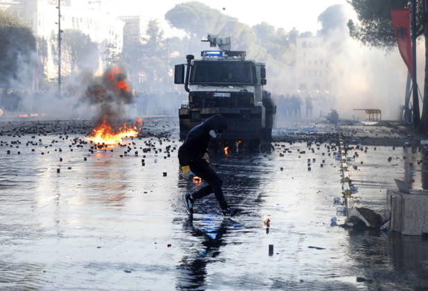 Protesters Clash with Police During a Demonstration in Tirana, Albania. Protesters throw molotov cocktails towards Albanian Police officers during during an anti-government demonstration in central Tirana on October 17, 2026, as protests continued for a fifth consecutive day over university conditions and demands for the resignation of Albanian Prime Minister Edi Rama. The latest rally follows four nights of violence in the capital, during which protesters and riot police clashed, police used water cannons and tear gas, and demonstrators damaged government offices and shops and set fire to several buildings. Light Studio Agency Malton Dibra Tirana Albania Copyright: xLightxStudioxAgencyx xMaltonxDibrax