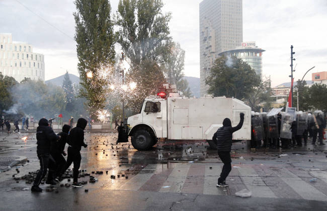 Protesters Clash with Police During a Demonstration in Tirana, Albania. Protesters throw stones towards Albanian Police officers during during an anti-government demonstration in central Tirana on October 17, 2026, as protests continued for a fifth consecutive day over university conditions and demands for the resignation of Albanian Prime Minister Edi Rama. The latest rally follows four nights of violence in the capital, during which protesters and riot police clashed, police used water cannons and tear gas, and demonstrators damaged government offices and shops and set fire to several buildings. Light Studio Agency Malton Dibra Tirana Albania Copyright: xLightxStudioxAgencyx xMaltonxDibrax