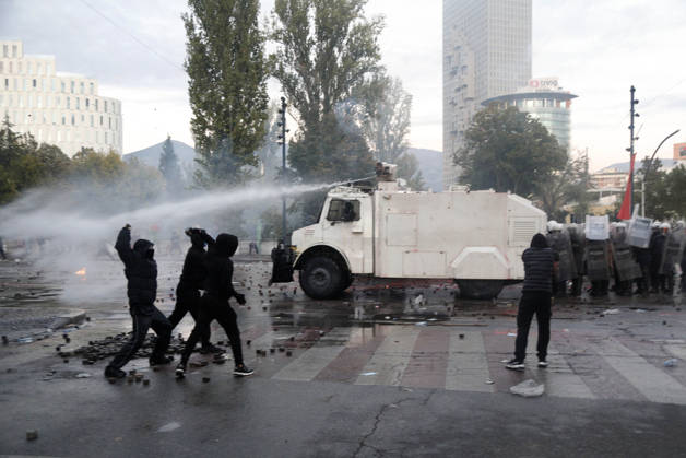 Protesters Clash with Police During a Demonstration in Tirana, Albania. Protesters throw stones towards Albanian Police officers during during an anti-government demonstration in central Tirana on October 17, 2026, as protests continued for a fifth consecutive day over university conditions and demands for the resignation of Albanian Prime Minister Edi Rama. The latest rally follows four nights of violence in the capital, during which protesters and riot police clashed, police used water cannons and tear gas, and demonstrators damaged government offices and shops and set fire to several buildings. Light Studio Agency Malton Dibra Tirana Albania Copyright: xLightxStudioxAgencyx xMaltonxDibrax