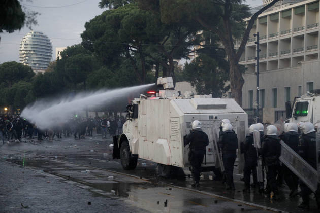 Protesters Clash with Police During a Demonstration in Tirana, Albania. Protesters throw stones towards Albanian Police officers during during an anti-government demonstration in central Tirana on October 17, 2026, as protests continued for a fifth consecutive day over university conditions and demands for the resignation of Albanian Prime Minister Edi Rama. The latest rally follows four nights of violence in the capital, during which protesters and riot police clashed, police used water cannons and tear gas, and demonstrators damaged government offices and shops and set fire to several buildings. Light Studio Agency Malton Dibra Tirana Albania Copyright: xLightxStudioxAgencyx xMaltonxDibrax