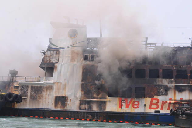 Efforts are underway to extinguish a fire that broke out on a passenger ferry in Indonesia s Cilegon PELABUHAN MERAK, CILEGON, INDONESIA - OCTOBER 21: Fireboats take turns spraying water onto the passenger ferry KMP Batumandi to cool down the vessel after it caught fire while preparing to dock off Merak Port in Cilegon, Banten, Indonesia on Wednesday, October 21, 2026. The vessel caught fire on Tuesday, October 20, and rescue operations remain underway as the ship continues to emit smoke. Water is continuously sprayed to cool the vehicle deck containing numerous cars, motorcycles, buses, and trucks, while authorities confirm no fatalities have been reported. Dasril Roszandi Anadolu Pelabuhan Merak Indonesia. Editorial use only. Please get Copyright: x2026xAnadoluxDasrilxRoszandix