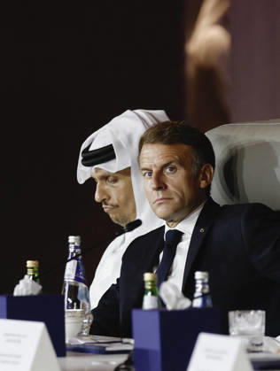 President Macron At The Opswf Summit During His Visit To Qatar French President Emmanuel Macron looks on alongside Qatari Prime Minister Sheikh Mohammed bin Abdulrahman Al Thani, as they attend the 9th Annual One Planet Sovereign Wealth Funds (OPSWF) Summit at the Rosewood Hotel in Lusail, Qatar, October 21, 2026. Photo by Benoit Tessier Pool ABACAPRESS.COM Lusail Qatar Copyright: xTessierxBenoit Pool ABACAx