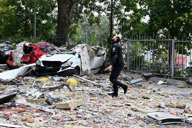 Aftermath Of A Russian Drone Strike In Kyiv Police officers walk on debris at the site of an apartment building damaged during a Russian drone strike in Kyiv, Ukraine, on October 21, 2026. Kyiv Ukraine  Copyright: xOleksandrxGusevx originalFilename: gusev-aftermat261021_npDY2.jpg