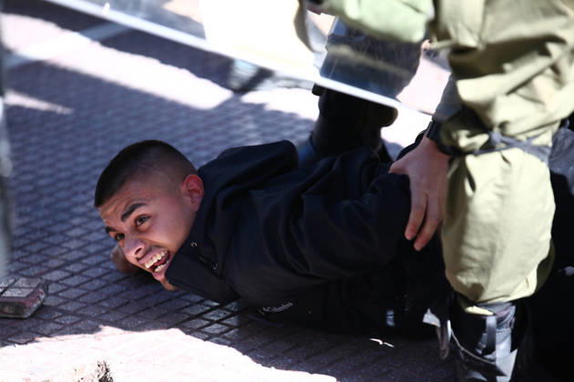 October 21, 2026, Athens, Attica, GREECE: A student is restrained on the ground by police officers during a detention following minor clashes between students and riot police in Omonia Square. Athens GREECE - ZUMAx103 20261021_zip_x103_031 Copyright: xHarrisxXanthopoulosx