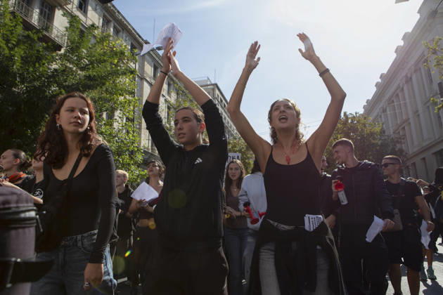 Athens Greece Living Costs Protest Protesters raise their hands and chant slogans during a rally in Athens, Greece on October 21, 2026. Students and other demonstrators marched through central Athens to protest rising living costs and economic pressures. Organizers say the concerns raised by participants echo grievances voiced during recent demonstrations in France. Athens Attica Greece Copyright: xElvisxTakahashixMantellox