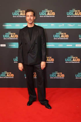 Florian David Fitz at the premiere of *Der perfekte Urlaub* at Cinedom on October 21, 2026, in Cologne, Germany. The premiere of *Der perfekte Urlaub* in Cologne, Germany