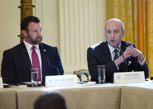 Deputy Chief of Staff Stephen Miller ??speaks as Homeland Security Secretary Markwayne Mullin (L) listens during a roundtable discussion on cybercrime in the East Room of the White House in Washington, DC on Wednesday, October 21, 2026. The discussion focuses on combatting foreign-based organized crime targeting Americans online and federal seizures of fraudulent crypto and scam websites. WAP20261021920 BONNIExCASH