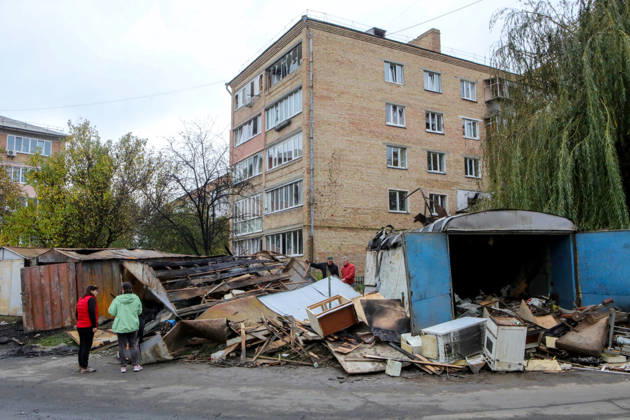 Residents stand near garages damaged by a Russian drone attack, Petropavlivska Borshchahivka, Kyiv region, Ukraine, October 21, 2026. (Photo by Volodymyr Tarasov Ukrinform) Consequences of Russian drone attack in Kyiv region  Copyright: xVolodymyrxTarasovx