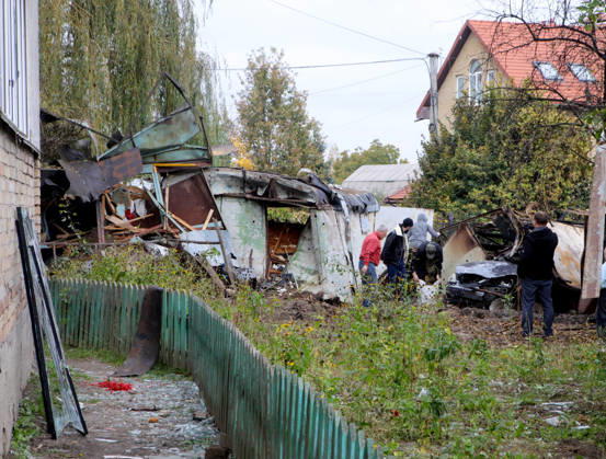 Residents stand near garages damaged by a Russian drone attack, Petropavlivska Borshchahivka, Kyiv region, Ukraine, October 21, 2026. (Photo by Volodymyr Tarasov Ukrinform) Consequences of Russian drone attack in Kyiv region  Copyright: xVolodymyrxTarasovx