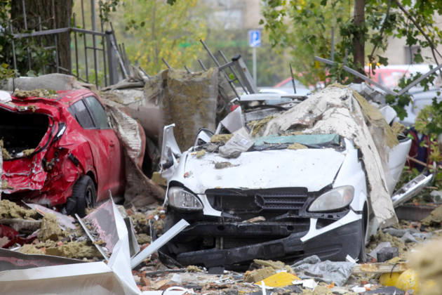 Rubble carpets the ground at a parking lot where cars were destroyed by a Russian drone strike on an apartment block in the Sviatoshynskyi district, Kyiv, Ukraine, October 21, 2026. The drone hit the building’s 20th floor, sparking a fire. Two people were killed in the attack. (Photo by Volodymyr Tarasov Ukrinform) Russian drone hits 24-storey apartment block in Kyiv  Copyright: xVolodymyrxTarasovx