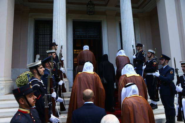 October 22, 2026, Athens, Greece: Members of the delegation accompanying Abu Dhabi Crown Prince Sheikh Khaled bin Mohamed bin Zayed Al Nahyan, including a woman dressed in black, ascend the steps of the Maximos Mansion in Athens ahead of an official meeting with Greek Prime Minister Kyriakos Mitsotakis. A military honour guard stands at attention on either side of the entrance as the Emirati delegation enters the Greek prime minister™s official residence. Athens Greece - ZUMAv62_ 20261022_zaf_v62_017 Copyright: xAristidisxVafeiadakisx