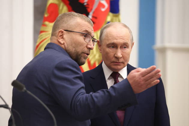 RUSSIA, MOSCOW - OCTOBER 22, 2026: Russia s President Vladimir Putin (R) and the Federal Customs Service of Russia to the agency s head Valery Pikalev during a ceremony at the Kremlin in which Pikalev was presented the agency s banner. Approved by a presidential decree in 2019, the banner has not yet been presented to the agency s top official. Pelageya Tikhonova POOL TASS  99764165