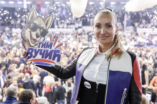 SERBIA, BELGRADE - OCTOBER 22, 2026: A woman attends a rally at the Ranko Zeravica Sports Hall in support of Serbia s former President Aleksandar Vucic ahead of the 2026 Serbian parliamentary election scheduled for October 25. Vucic will head the list of the ruling Serbian Progressive Party (SNS) and run as its prime ministerial candidate Belgrade Serbia  - ZUMAt113 20261022_zaa_t113_525 Copyright: xAlexanderxRyuminx