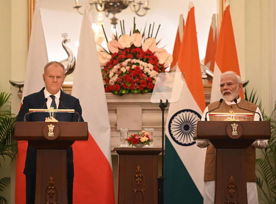 NEW DELHI, INDIA - OCTOBER 22: Prime Minister Narendra Modi (R) and Prime Minister of Poland Donald Tusk (L) address a joint press statement following delegation-level bilateral talks at Hyderabad House on October 22, 2026 in New Delhi, India. The high-level meeting marked Polish Prime Minister Tusk s official visit to India from October 21-23, 2026 his first visit to the country as Prime Minister since 2010 aimed at advancing the India-Poland Strategic Partnership and deepening India-EU strategic ties. During wide-ranging discussions, both leaders reviewed bilateral cooperation across key sectors including trade, technology, defense-industrial collaboration, and energy, while reaffirming joint commitment toward peaceful diplomatic solution