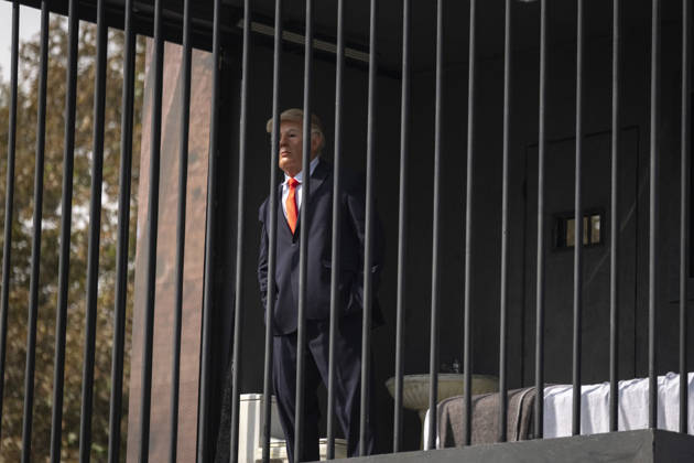 Anti-U.S. President Trump Performance On Billboard Reactions An Iranian masked man performs as U.S. President Donald Trump inside a symbolic cell mounted on a billboard in northern Tehran, Iran, on October 22, 2026, amid escalating tensions between Iran and the United States. Tehran Tehran Iran  Copyright: xMortezaxNikoubazlx originalFilename: nikoubazl-antiuspr261022_np385.jpg