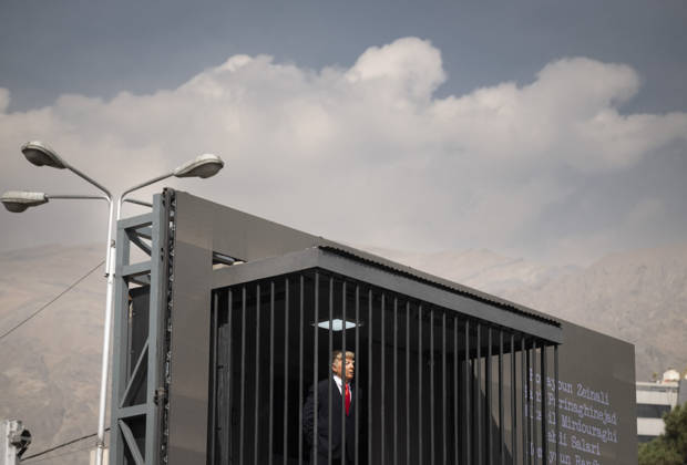 Anti-U.S. President Trump Performance On Billboard Reactions An Iranian masked man performs as U.S. President Donald Trump inside a symbolic cell mounted on a billboard in northern Tehran, Iran, on October 22, 2026, amid escalating tensions between Iran and the United States. Tehran Tehran Iran  Copyright: xMortezaxNikoubazlx originalFilename: nikoubazl-antiuspr261022_np4Pv.jpg