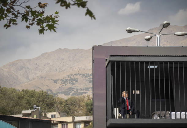 Anti-U.S. President Trump Performance On Billboard Reactions An Iranian masked man performs as U.S. President Donald Trump inside a symbolic cell mounted on a billboard in northern Tehran, Iran, on October 22, 2026, amid escalating tensions between Iran and the United States. Tehran Tehran Iran  Copyright: xMortezaxNikoubazlx originalFilename: nikoubazl-antiuspr261022_npIpS.jpg