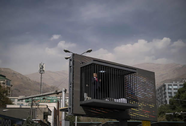 Anti-U.S. President Trump Performance On Billboard Reactions An Iranian masked man performs as U.S. President Donald Trump inside a symbolic cell mounted on a billboard in northern Tehran, Iran, on October 22, 2026, amid escalating tensions between Iran and the United States. Tehran Tehran Iran  Copyright: xMortezaxNikoubazlx originalFilename: nikoubazl-antiuspr261022_npKZZ.jpg
