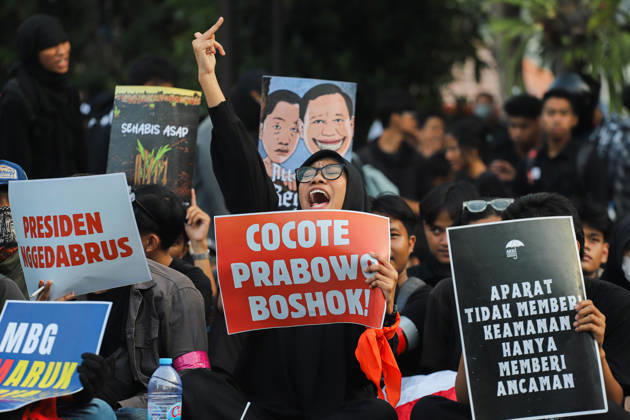 October 22, 2026, Surabaya, East Java, Indonesia: Demonstrators hold up posters during a protest in front of the Gedung Negara Grahadi in Surabaya, East Java, Indonesia, on October 22, 2026. The students demand accountability from the central and regional governments, alleging that both have failed to fulfill their political promises. Their demands include upholding civil supremacy, ending military involvement in the civil sphere, canceling the Free Nutritious Meal (MBG) program and the Red and White Village Cooperatives, and restoring the 20 percent education budget allocation as mandated by the constitution. They also request that forest and land fires (karhutla) be designated a national disaster. The protesters call for Prabowo Subianto - ZUMAp290 20261022_zip_p290_008 Copyright: xRendyxAgungxPrakosox
