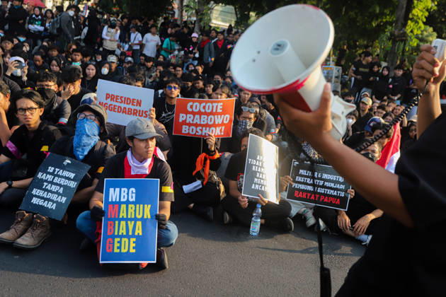 October 22, 2026, Surabaya, East Java, Indonesia: A protester addresses a crowd during a demonstration in front of the Gedung Negara Grahadi in Surabaya, East Java, Indonesia, on October 22, 2026. The demonstrators demand accountability from the central and regional governments, which they state have failed to fulfill political promises. Students voice demands including upholding civil supremacy, ending military involvement in the civil sphere, canceling the Free Nutritious Meal (MBG) program and the Red and White Village Cooperatives, and restoring the 20 percent education budget allocation mandated by the constitution. They also request that forest and land fires (karhutla) be designated a national disaster. The group calls for Prabowo Su - ZUMAp290 20261022_zip_p290_002 Copyright: xRendyxAgungxPrakosox
