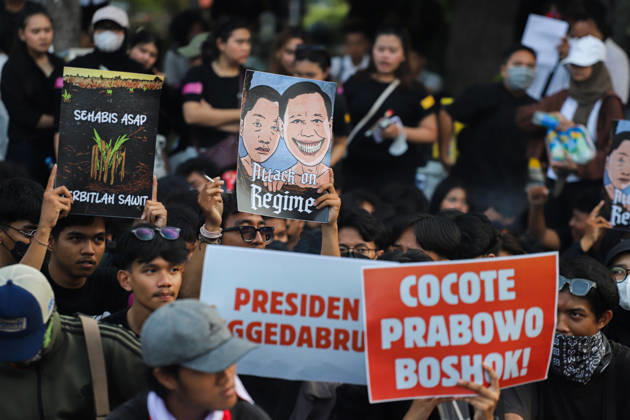 October 22, 2026, Surabaya, East Java, Indonesia: Demonstrators hold up posters during a protest in front of the Gedung Negara Grahadi in Surabaya, East Java, Indonesia, on October 22, 2026. The students demand accountability from the central and regional governments, alleging that both have failed to fulfill their political promises. Their demands include upholding civil supremacy, ending military involvement in the civil sphere, canceling the Free Nutritious Meal (MBG) program and the Red and White Village Cooperatives, and restoring the 20 percent education budget allocation as mandated by the constitution. They also request that forest and land fires (karhutla) be designated a national disaster. The protesters call for Prabowo Subianto - ZUMAp290 20261022_zip_p290_007 Copyright: xRendyxAgungxPrakosox