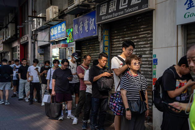 First Day on sale of IPhone Duo in Hong Kong People selling iPhones Duo lining up outside Sin Tat Plaza, a popular iPhone location for phone resellers on October 22, 2026 in Hong Kong. The iPhone DUO is Apple INC.™s first foldable phone, today is the first day the new iPhone DUO is available to the public. (Photo by Vernon Yuen Nexpher Images) HONG KONG HONG KONG
