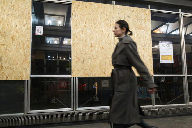 Kyiv Metro Station Partially Reopens After October 19 Russian Attack A woman passes OSB panels, replacing shattered windows at the Chernihivska metro station, which has partially resumed operations following a Russian attack on October 19, Kyiv, Ukraine, October 22, 2026. The massive strike damaged the station, tracks and the cable network. Photo by Kyrylo Chubotin Ukrinform ABACAPRESS.COM Kyiv Ukraine  Copyright: xChubotinxKirill Ukrinform ABACAx