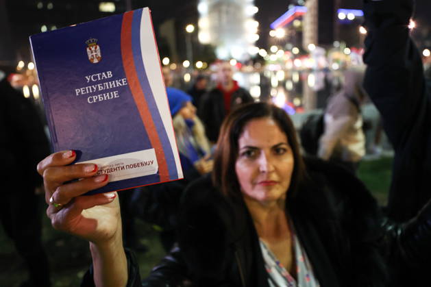 SERBIA, BELGRADE - OCTOBER 22, 2026: A woman appears with a copy of the Constitution of Serbia during a rally held by the Student List movement ahead of the 2026 Serbian parliamentary election scheduled for October 25. Alexander Ryumin TASS  99800936