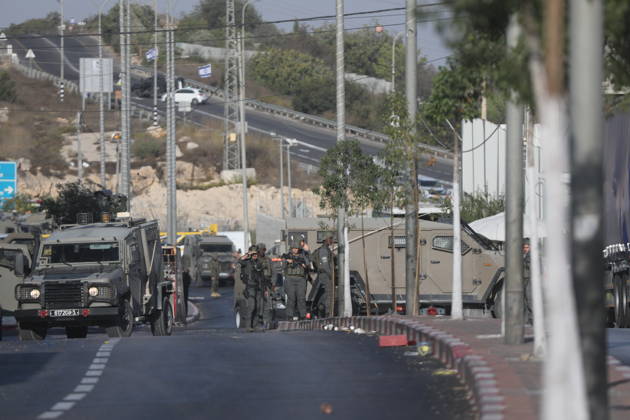Israeli forces kill two Palestinians in Farsh Al Hawa area of Hebron HEBRON, WEST BANK, PALESTINE - OCTOBER 23: Israeli forces stand guard in the Farsh Al Hawa area at the northern entrance to Hebron after Israeli soldiers shot and killed two Palestinians alleging they had launched an attack targeting Israelis in the vicinity before sealing off the area with military security cordons in West Bank, Palestine on October 23, 2026. Mamoun Wazwaz Anadolu Hebron West Bank. Editorial use only. Please get in touch for any other usage.  Copyright: x2026xAnadoluxMamounxWazwazx