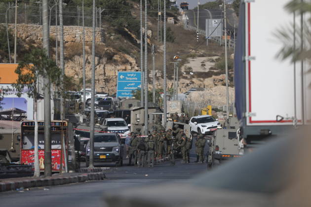 Israeli forces kill two Palestinians in Farsh Al Hawa area of Hebron HEBRON, WEST BANK, PALESTINE - OCTOBER 23: Israeli forces stand guard in the Farsh Al Hawa area at the northern entrance to Hebron after Israeli soldiers shot and killed two Palestinians alleging they had launched an attack targeting Israelis in the vicinity before sealing off the area with military security cordons in West Bank, Palestine on October 23, 2026. Mamoun Wazwaz Anadolu Hebron West Bank. Editorial use only. Please get in touch for any other usage.  Copyright: x2026xAnadoluxMamounxWazwazx
