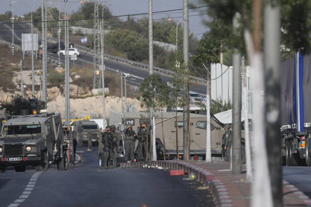 Israeli forces kill two Palestinians in Farsh Al Hawa area of Hebron HEBRON, WEST BANK, PALESTINE - OCTOBER 23: Israeli forces stand guard in the Farsh Al Hawa area at the northern entrance to Hebron after Israeli soldiers shot and killed two Palestinians alleging they had launched an attack targeting Israelis in the vicinity before sealing off the area with military security cordons in West Bank, Palestine on October 23, 2026. Mamoun Wazwaz Anadolu Hebron West Bank. Editorial use only. Please get in touch for any other usage.  Copyright: x2026xAnadoluxMamounxWazwazx