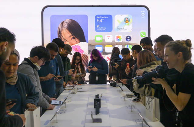 October 23, 2026, London, London, UK: London, UK. Customers inside the Apple Covent Garden store view and buy the new Apple iPhone Duo, the companyâ€⠢s first foldable iPhone. Opened, it is the thinnest iPhone ever, with a 7.6-inch inner display that provides a large canvas for viewing content, gaming, and multitasking, and a special nano-texture finish that minimises glare for an unparalleled viewing experience. Closed, the 5.4-inch outer display delivers 90 percent of the screen area of iPhone 18 Pro in a compact, pocketable design. London UK - ZUMAl94_ 20261023_zaf_l94_015 Copyright: xRayxTangx