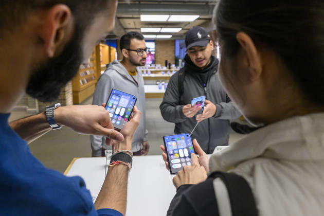 October 23, 2026, London, London, UK: London, UK. Customers inside the Apple Covent Garden store view and buy the new Apple iPhone Duo, the companyâ€⠢s first foldable iPhone. Opened, it is the thinnest iPhone ever, with a 7.6-inch inner display that provides a large canvas for viewing content, gaming, and multitasking, and a special nano-texture finish that minimises glare for an unparalleled viewing experience. Closed, the 5.4-inch outer display delivers 90 percent of the screen area of iPhone 18 Pro in a compact, pocketable design. London UK - ZUMAl94_ 20261023_zaf_l94_020 Copyright: xRayxTangx
