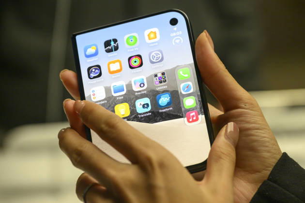 October 23, 2026, London, London, UK: London, UK. Customers inside the Apple Covent Garden store view and buy the new Apple iPhone Duo, the companyâ€⠢s first foldable iPhone. Opened, it is the thinnest iPhone ever, with a 7.6-inch inner display that provides a large canvas for viewing content, gaming, and multitasking, and a special nano-texture finish that minimises glare for an unparalleled viewing experience. Closed, the 5.4-inch outer display delivers 90 percent of the screen area of iPhone 18 Pro in a compact, pocketable design. London UK - ZUMAl94_ 20261023_zaf_l94_023 Copyright: xRayxTangx