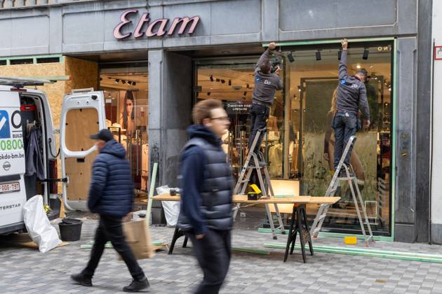 Storefronts boarded up with wooden panels at Rue Neuve Nieuwstraat, in Brussels, on Friday 23 October 2026. Stores are preparing for another protest scheduled for Saturday.  NICOLASxMAETERLINCK 190739540